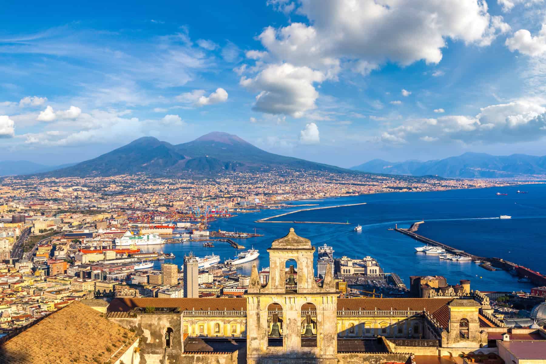Napoli (Naples) and mount Vesuvius in the background at sunset in a summer day, Italy, Campania