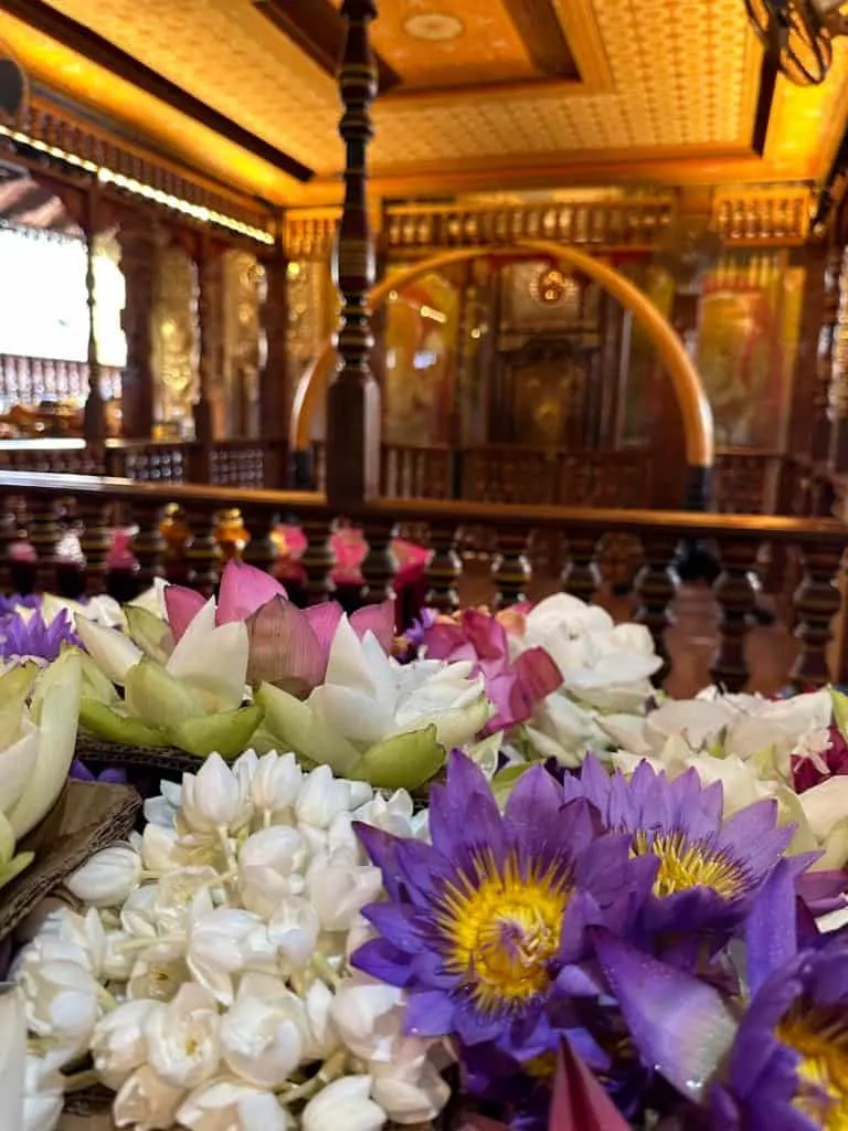 Flower offerings in front of the shrine of the Buddha's tooth relic in Sri Dalada Maligawa temple