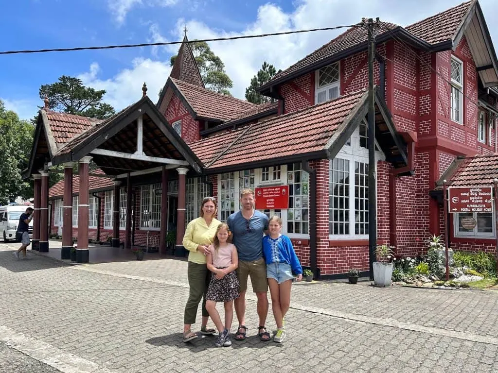 The Tin Box family stood in front of a colonial post office