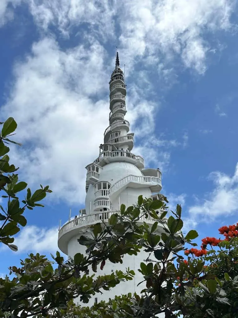 View of the top of Ambuluwawa Tower from foliage below