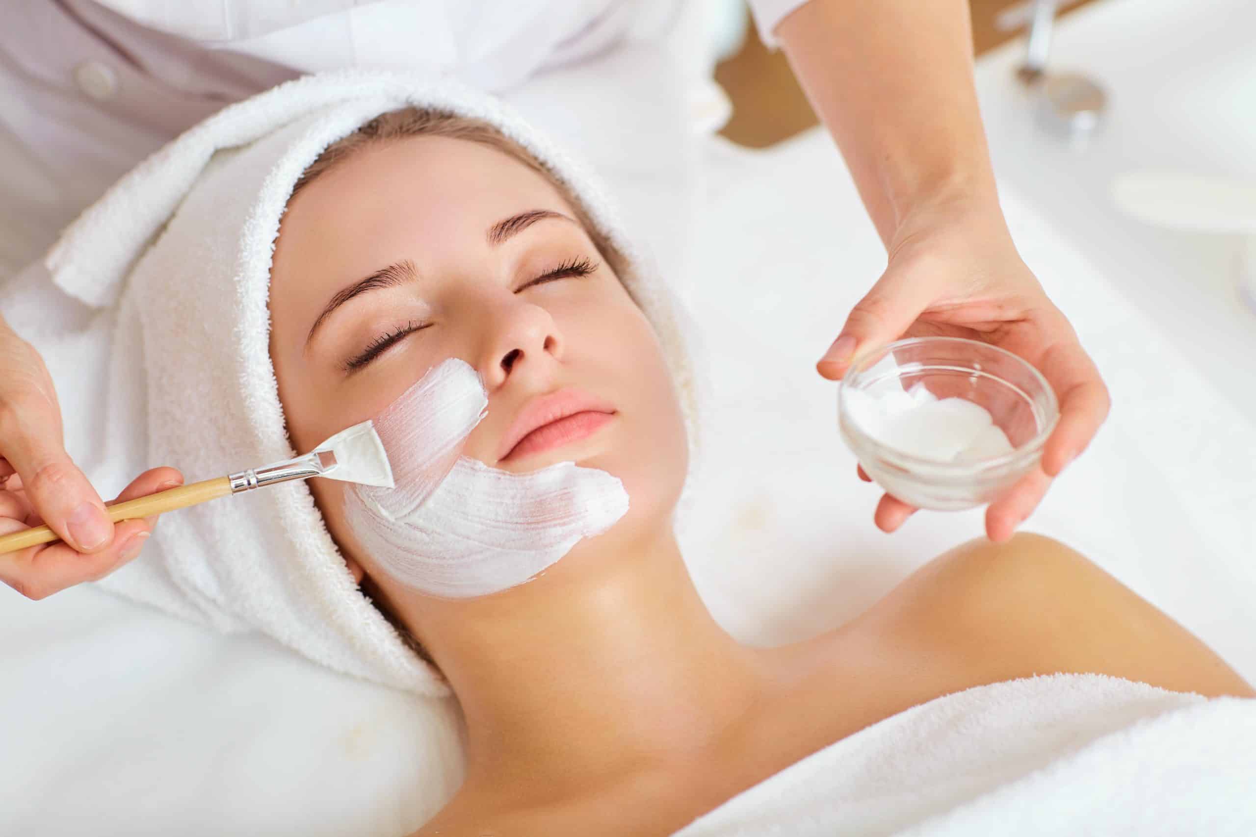 Woman in mask on face in spa beauty salon.