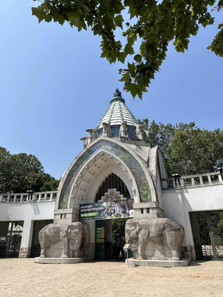 The entrance to Budapest Zoo - a grand archway with two elephant statues on either side