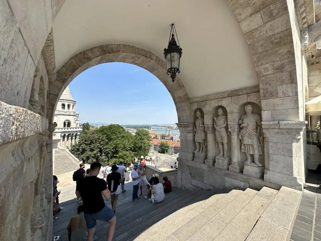 A view down towards the Danube River through an arch in the Fisherman's Bastion
