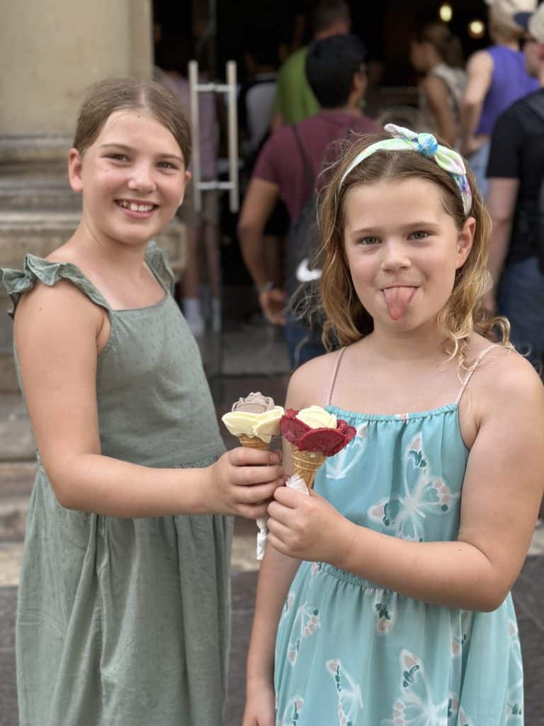 Our girls holding ice cream cones from Gelato Rosa. The ice cream has been scooped and shaped as petals