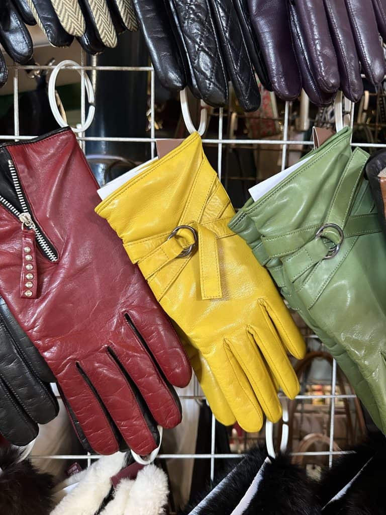 A row of leather gloves in red, yellow and green