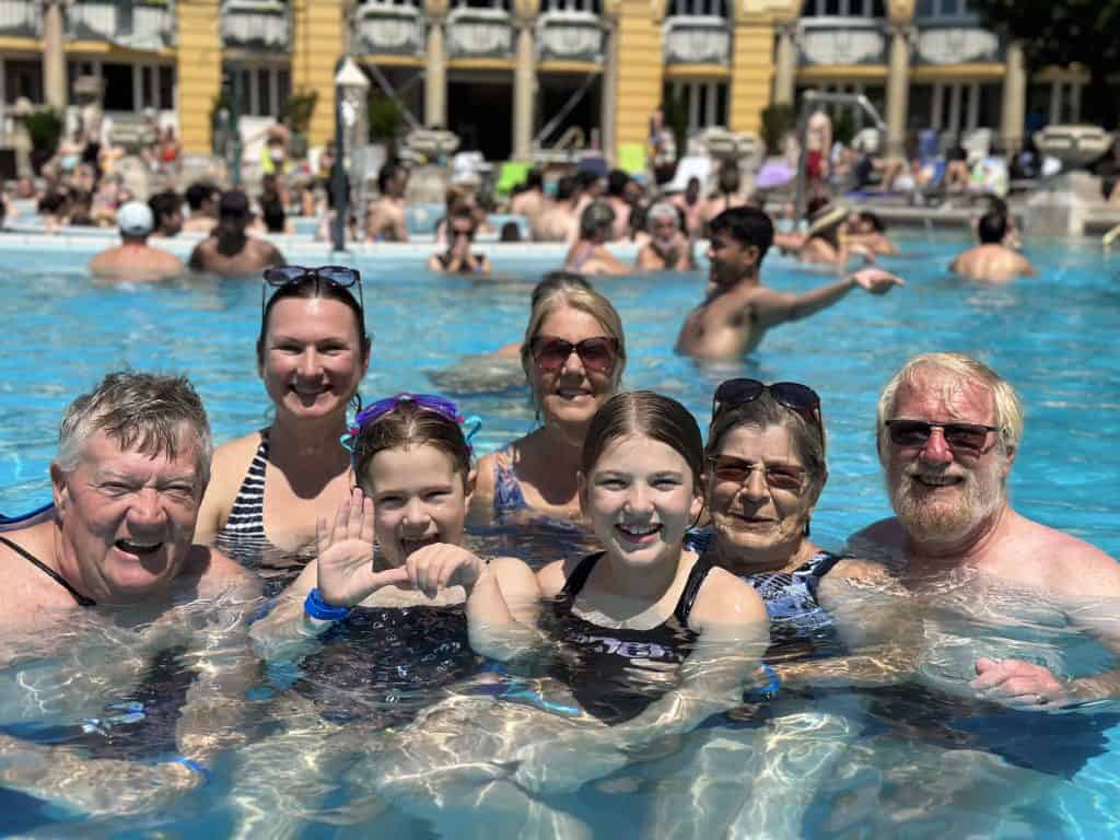 Our multi-generation group in a swimming pool at Széchenyi Thermal Bath which is the largest thermal bath complex in Europe