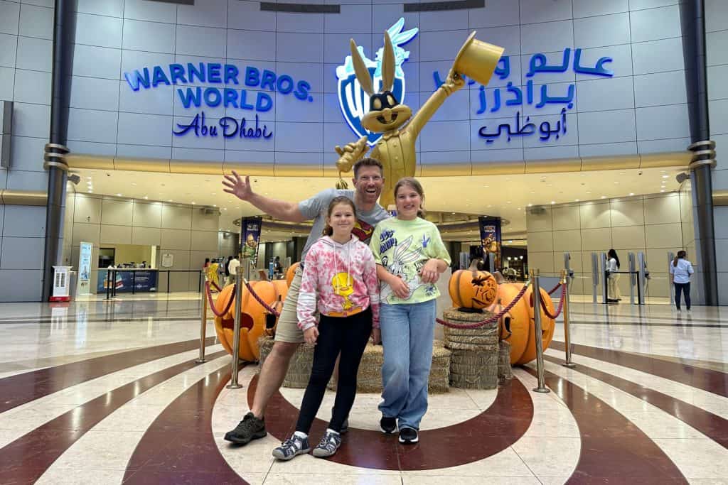 My family posing in front of a Bugs Bunny statue at the entrance to the Warner Bros World in Abu Dhabi