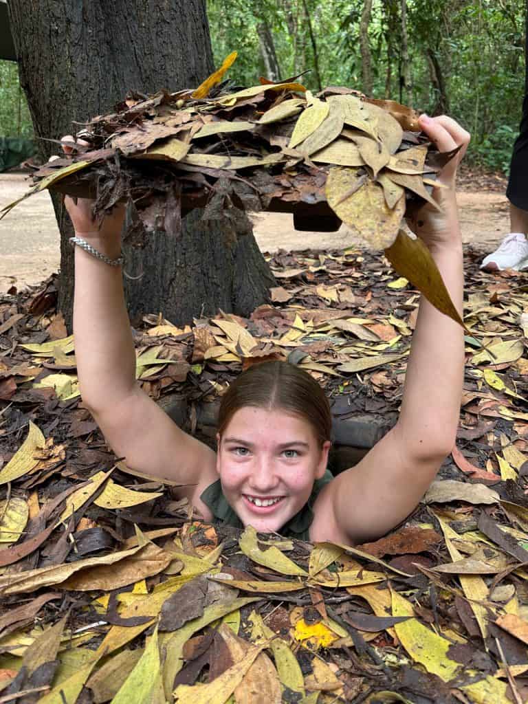 Our 11-year-old in in a tunnel entrance and holds the lid above her head