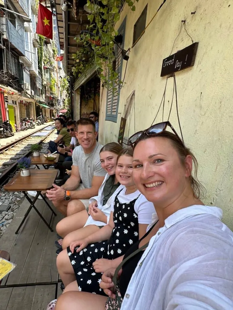 Our family sat beside the the train tracks in Hanoi's famous Train Street