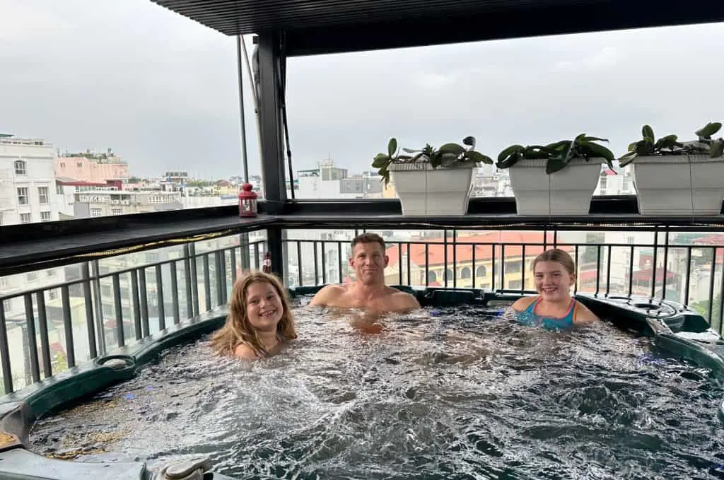 Mr Tin Box and our daughters sat in a bubbling hot tub on the roof of our hotel