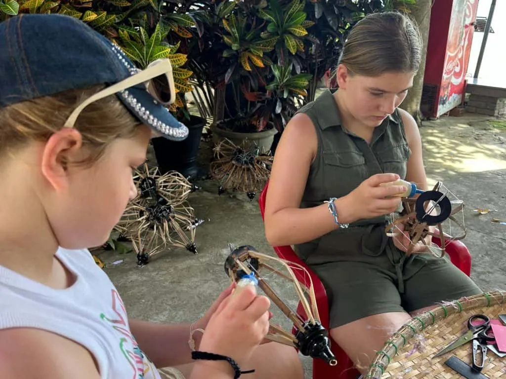 Our daughters working on making lanterns