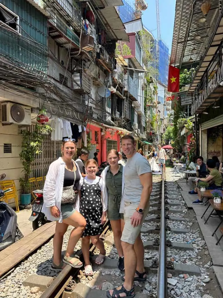 Our family stood on the trail tracks in Hanoi's famous Train Street