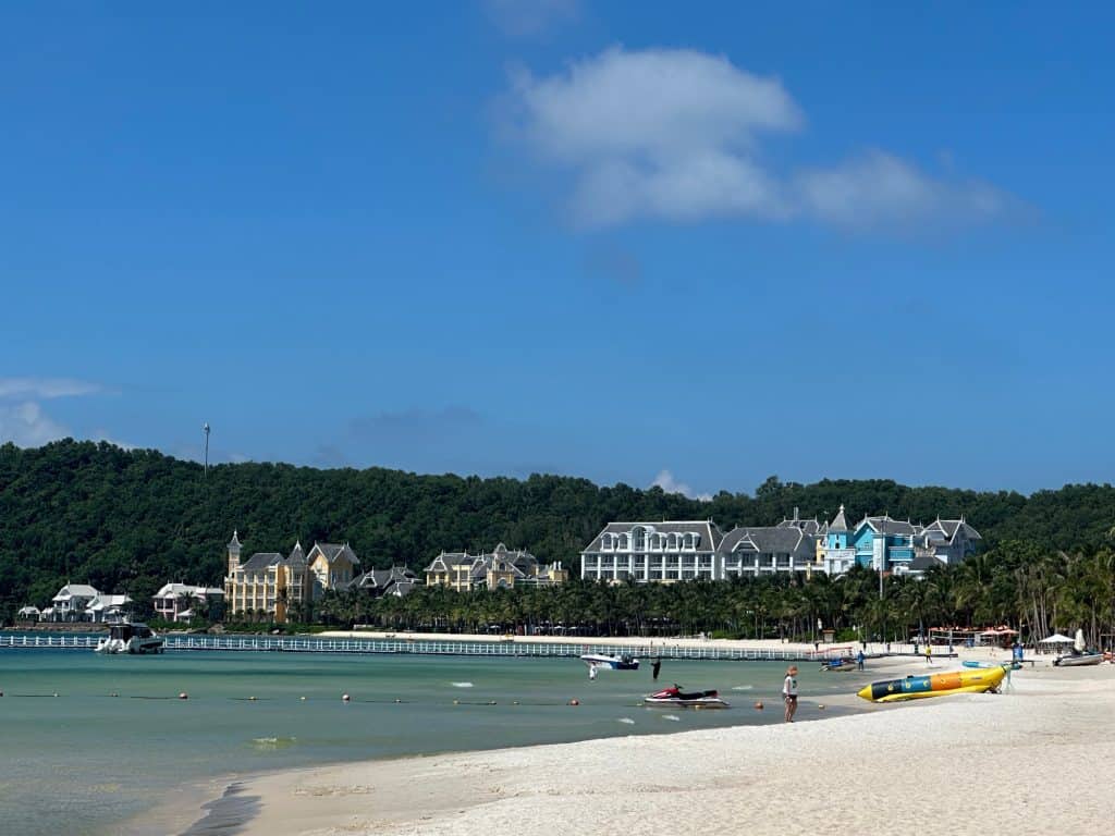 A view down Khem beach towards the brightly coloured buildings of the JW Marriott Hotel