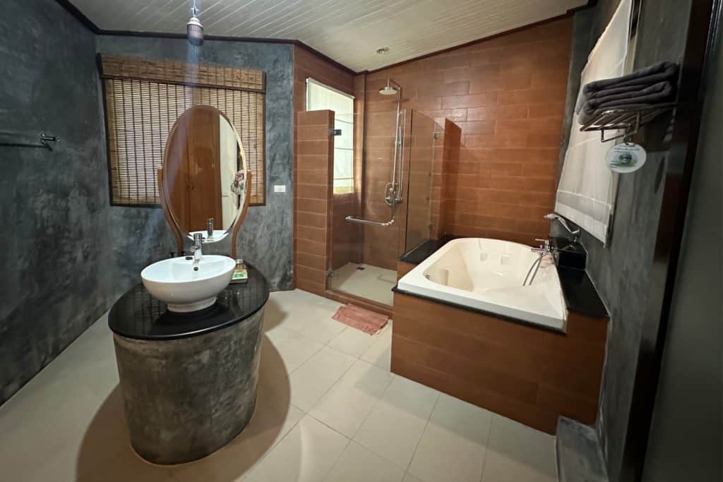 The large bathroom with bath, down and island sink in one of our bungalows at Aonang Phu Petra resort