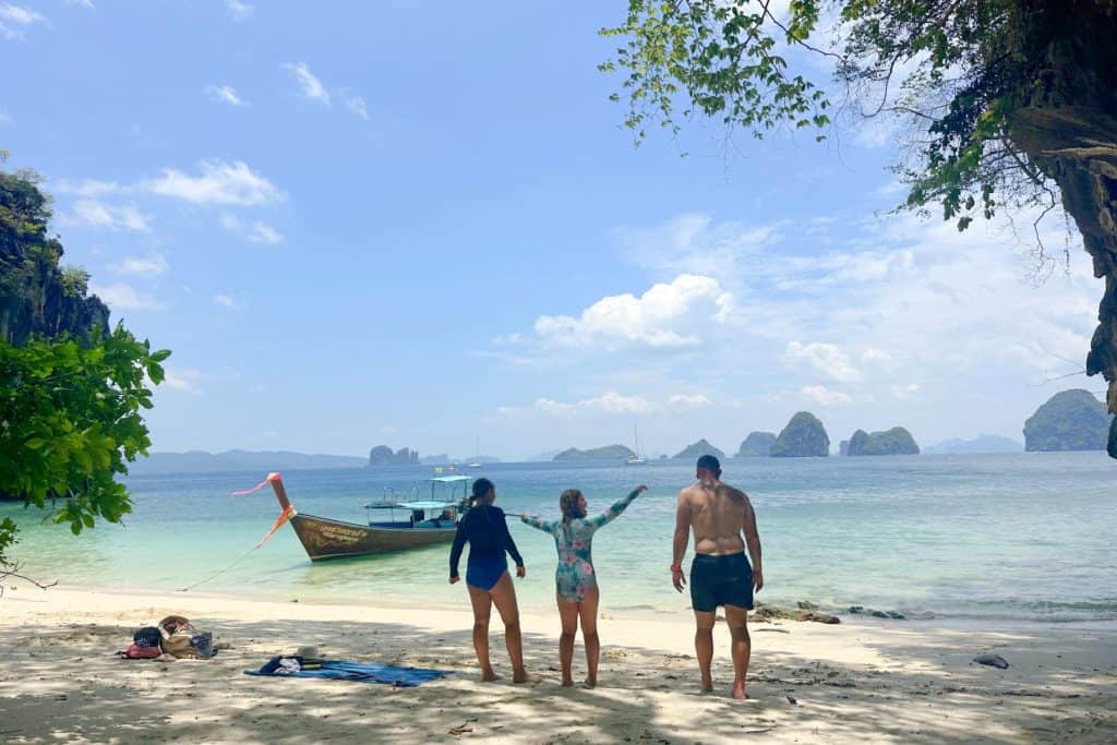 My family playing a game on the beach on a small beach on the outside of Hong Island. Other small islands are visible on the horizon