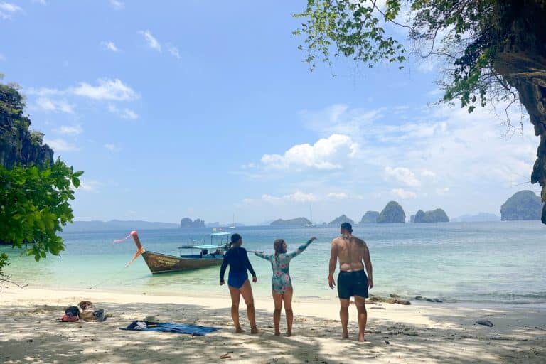 My family playing a game on the beach on a small beach on the outside of Hong Island. Other small islands are visible on the horizon