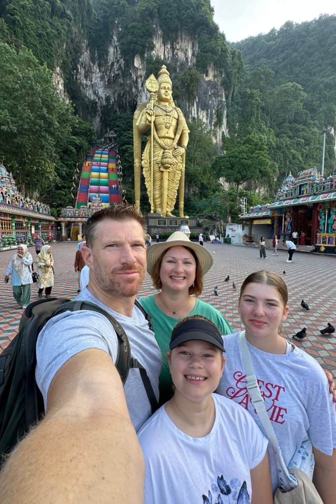 My family and I posing for a selfie at the bottom of the steps at the Batu Cave