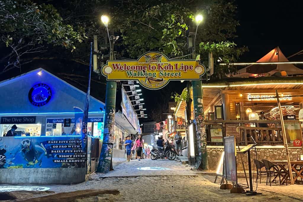 Looking up Walking Street at night from the entrance on Pattaya Beach in Ko Lipe