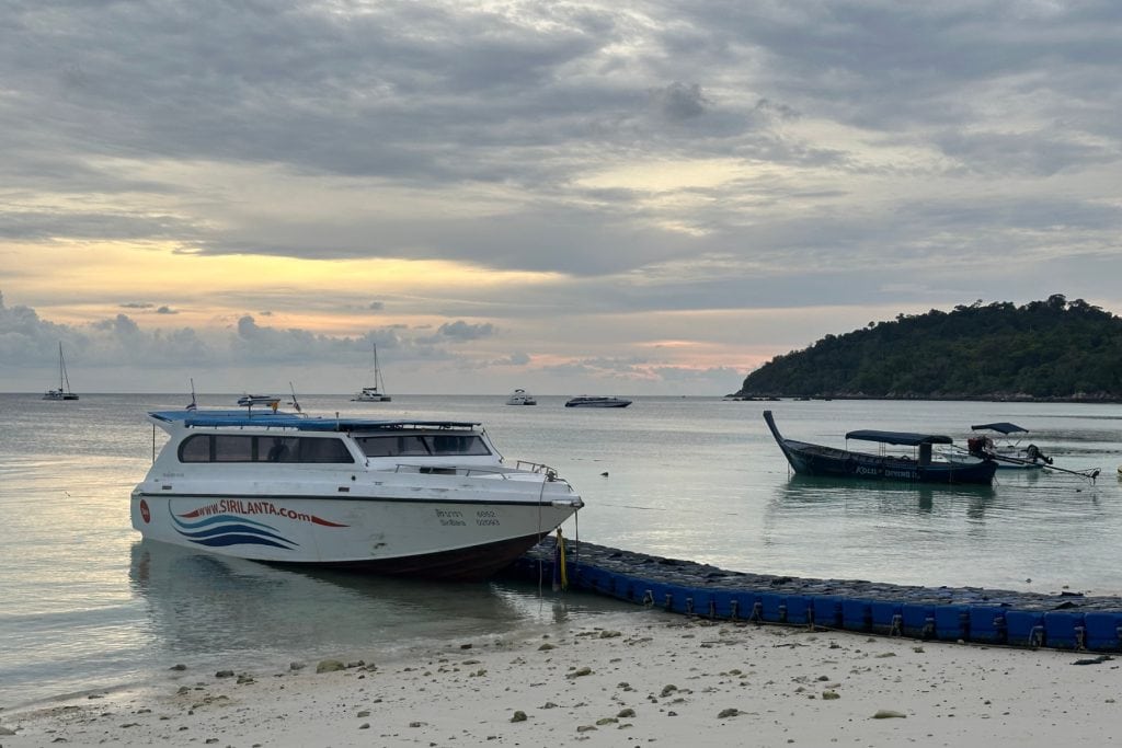 A Sirilanta speedboat sits on the sand at low tide on the Thai island of Koh Lipe
