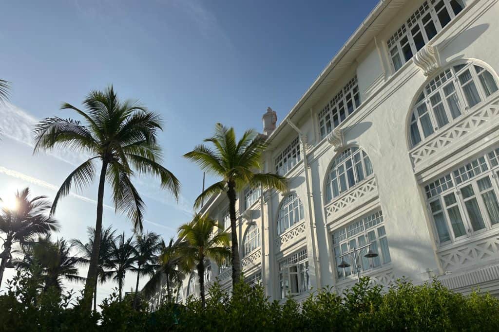 Palm trees and plant beds on the sea side of the E&O hotel