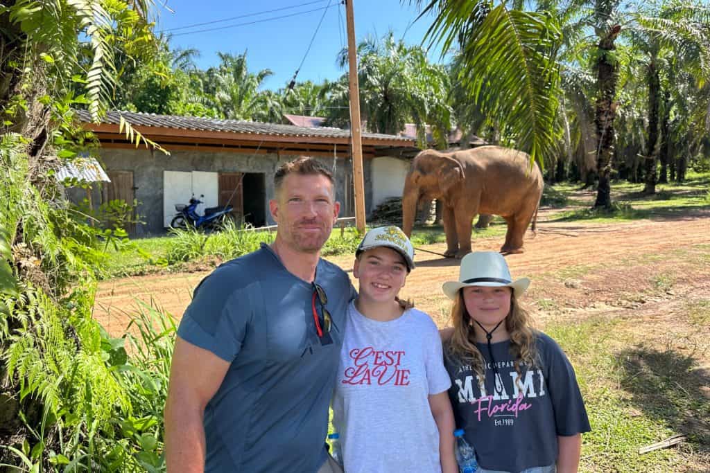 My family stood at a safe distance from a rescued elephant while it explores the Following Giants elephant sanctuary in Krabi, Thailand