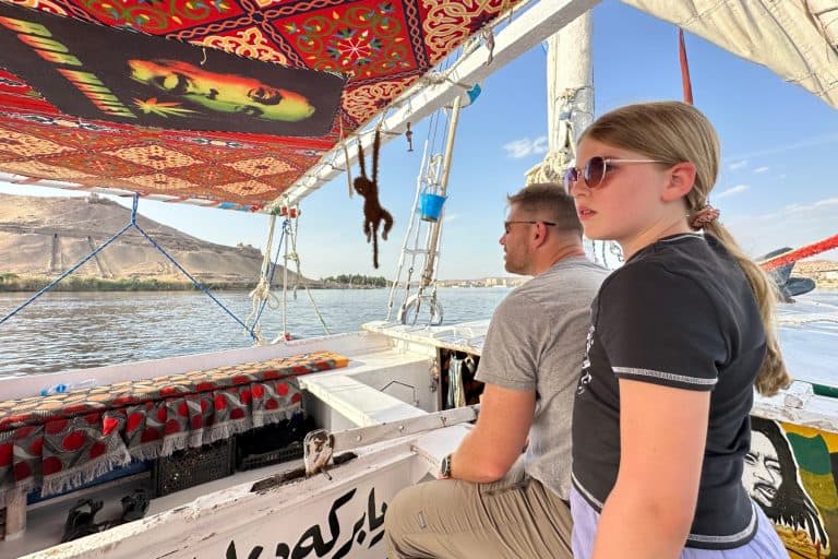 My daughter and husband admiring the view of Aswan from a felucca sailing on the nile