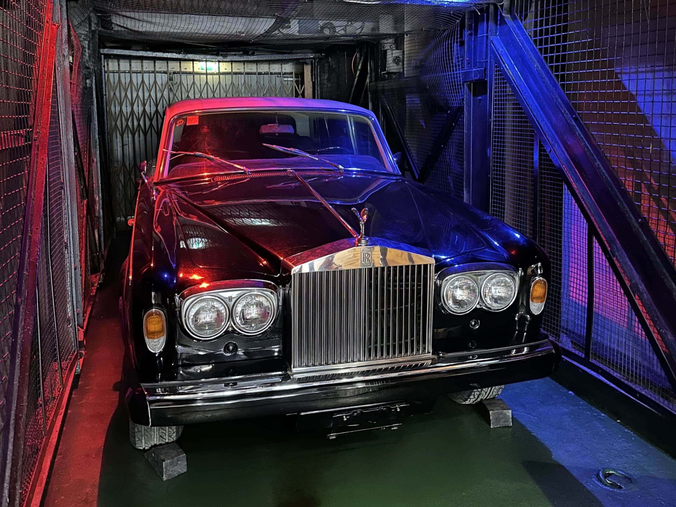 A black Rolls Royce in the car lift on the QE2