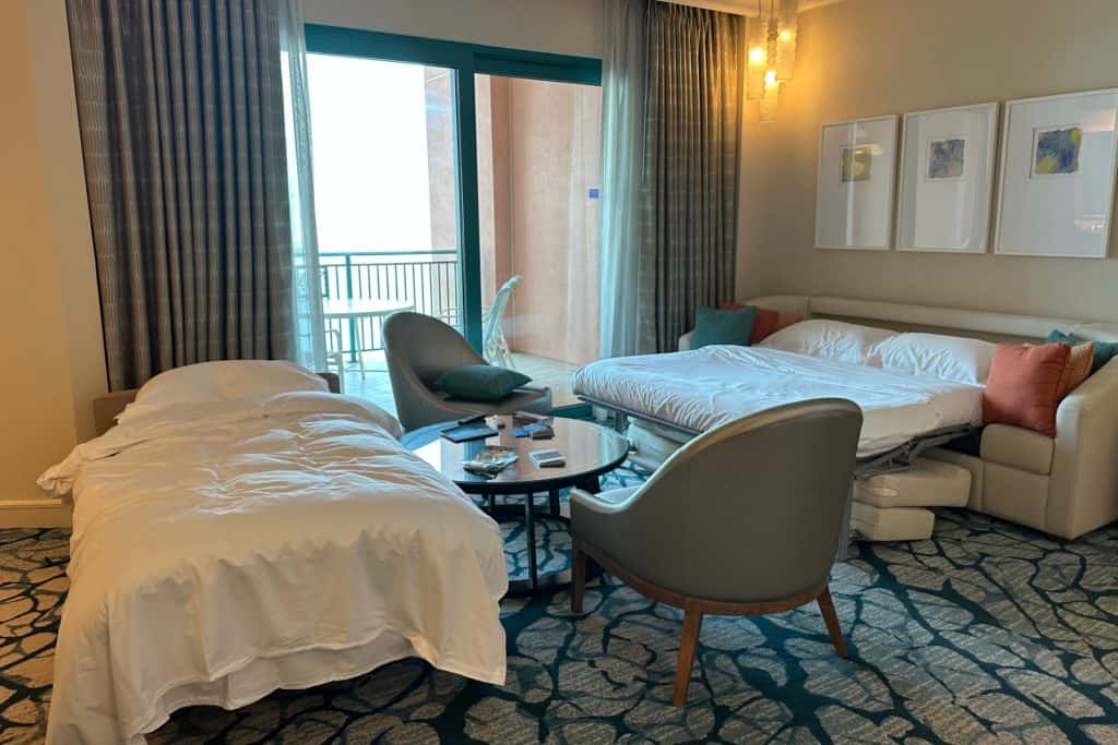 The lounge in our Terrace Suite laid out for bedtime with an extra single bed and the sofa bed made up