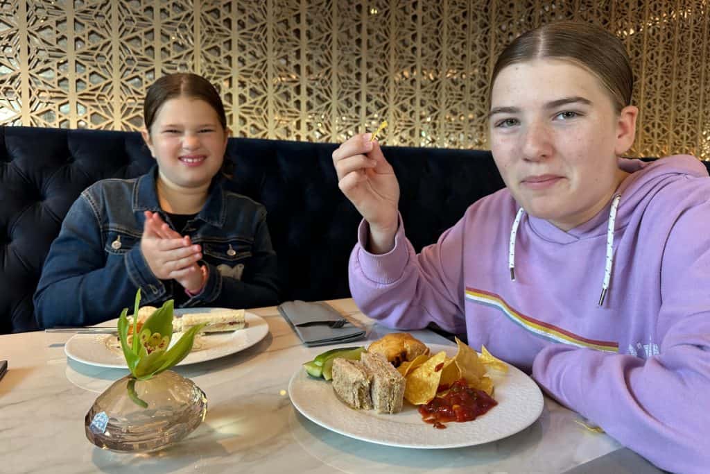 My girls with plates of afternoon tea nibbles in the Imperial Club Lounge. They look very happy with their selections