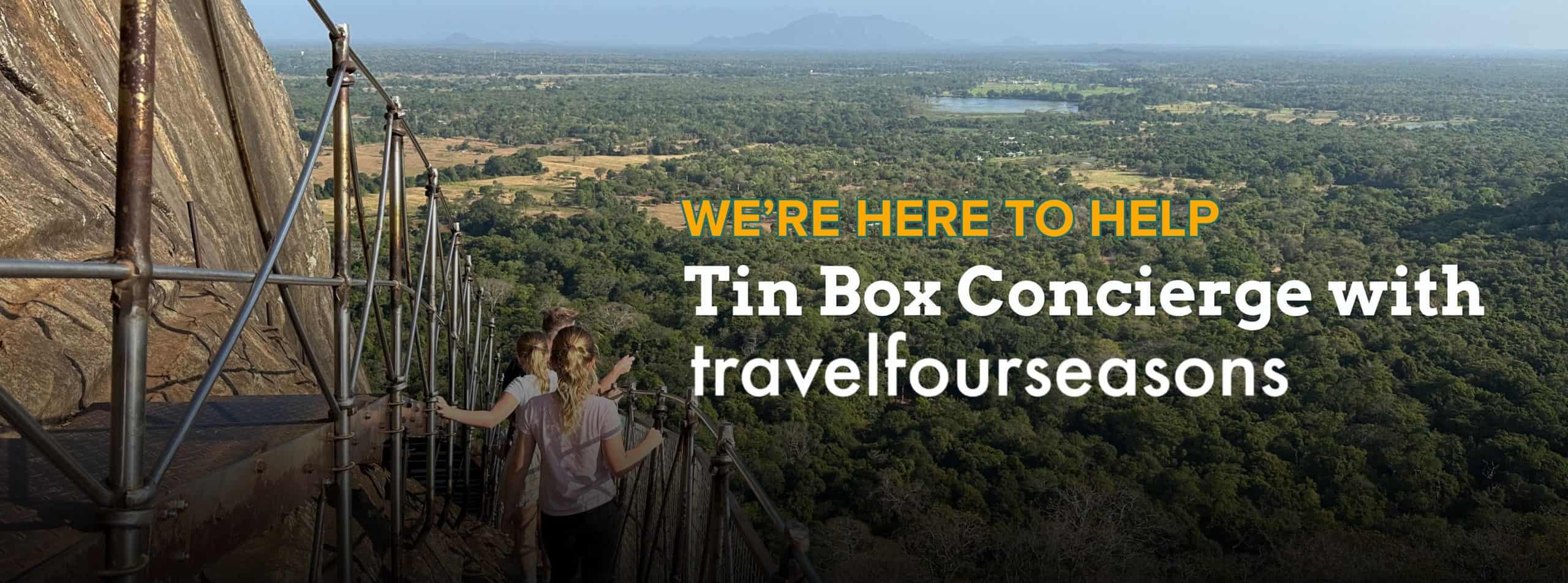 Cover image for Tin Box Concierge featuring my family walking down the narrow steps at Sigiriya in Sri Lanka with views of the jungle below