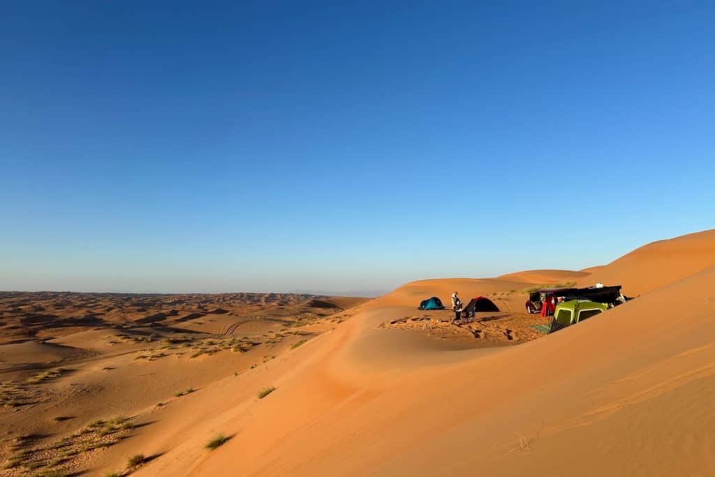 Tents pitched at the top of a sand dune in Wahiba Sands Oman