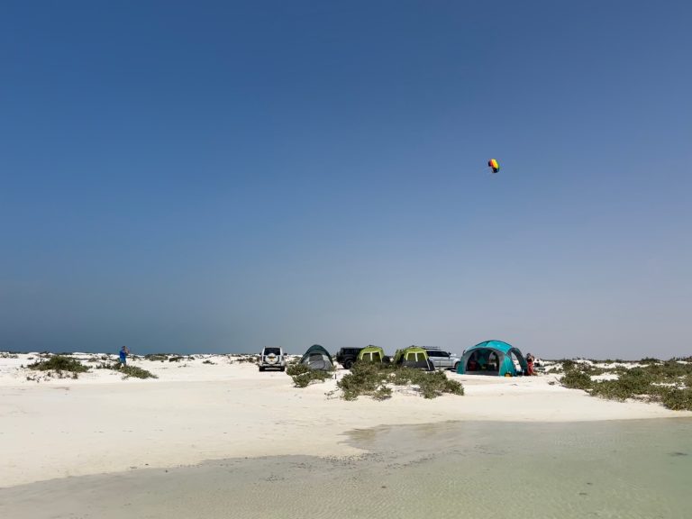 Tents pitched on a white sand beach at Barr Al Hikman in Oman