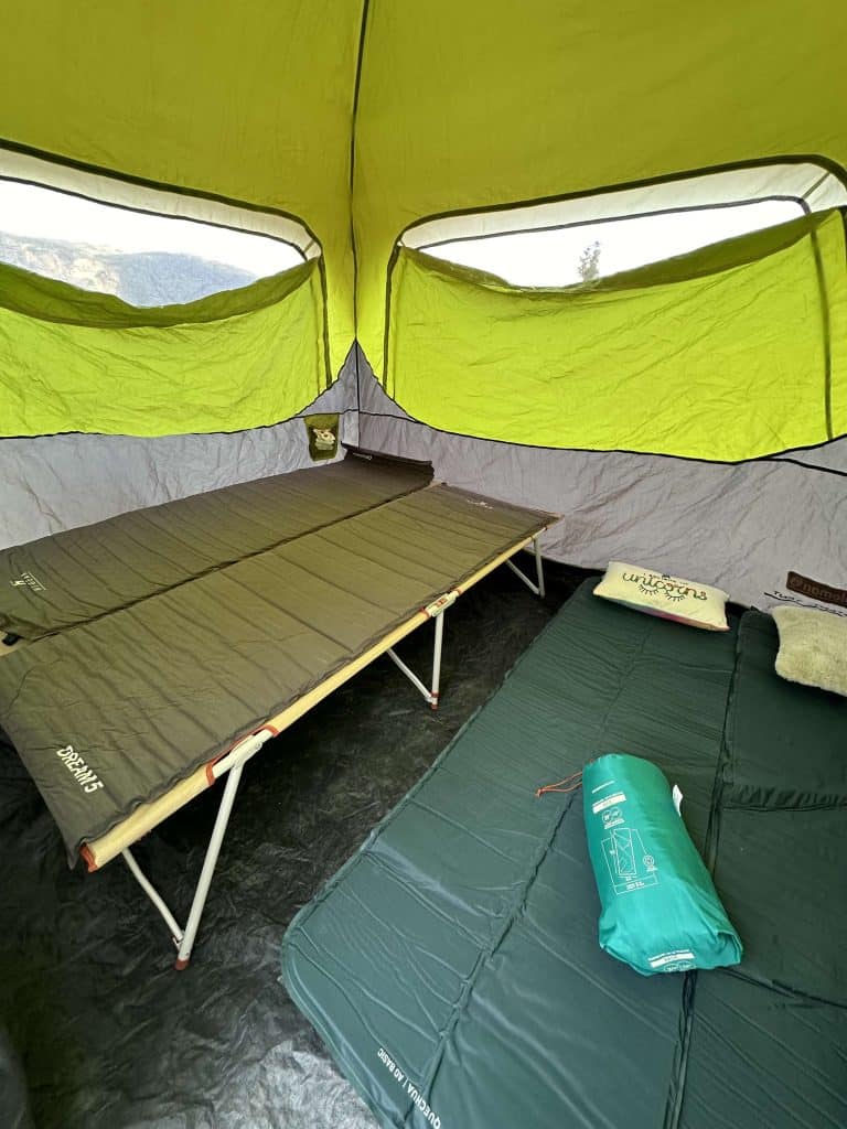 Our camping beds and self inflating mats laid out in our Coleman tent