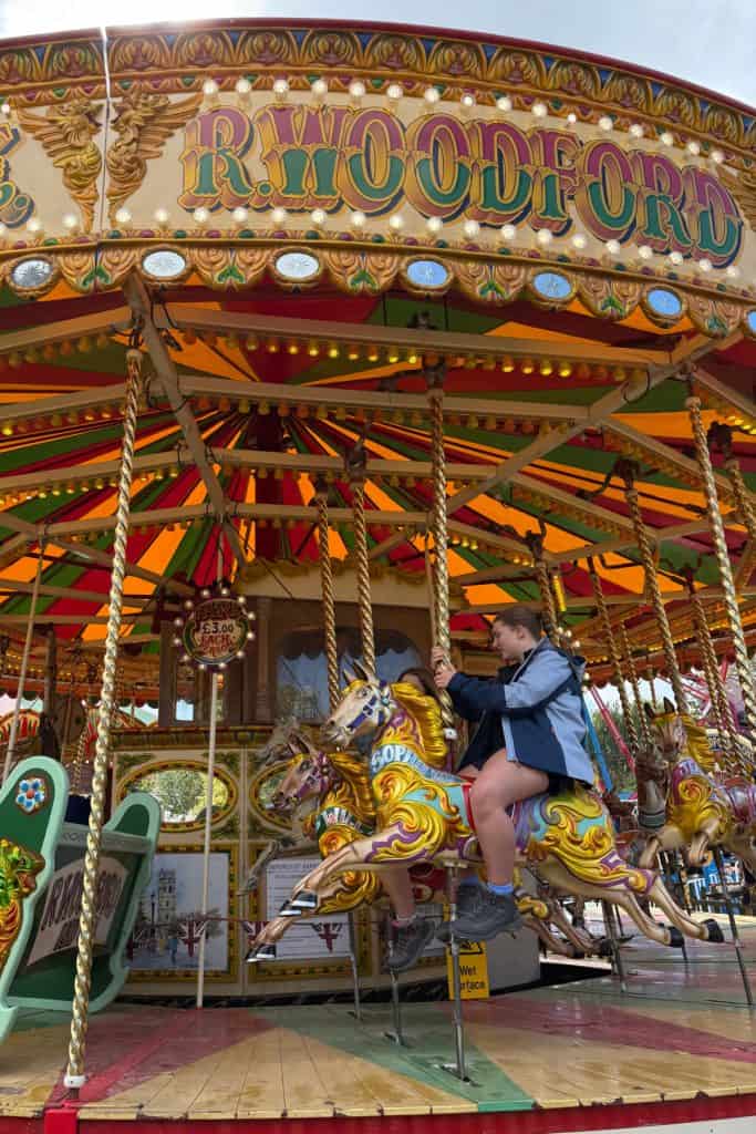 My daughters on the vintage carousel at Millets Farm
