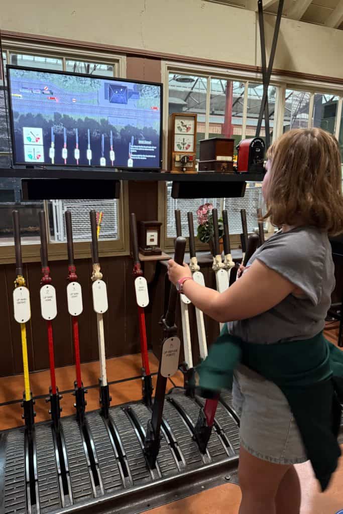 My 10-year-old daughter playing with the levers in an old signalling box at STEAM museum in Swindon