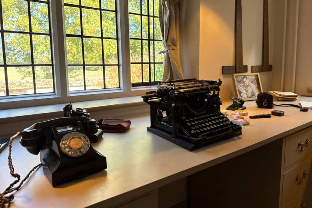 A 19th century phone and typewriter in Alexander Keiller's drawing room in Avebury Manor
