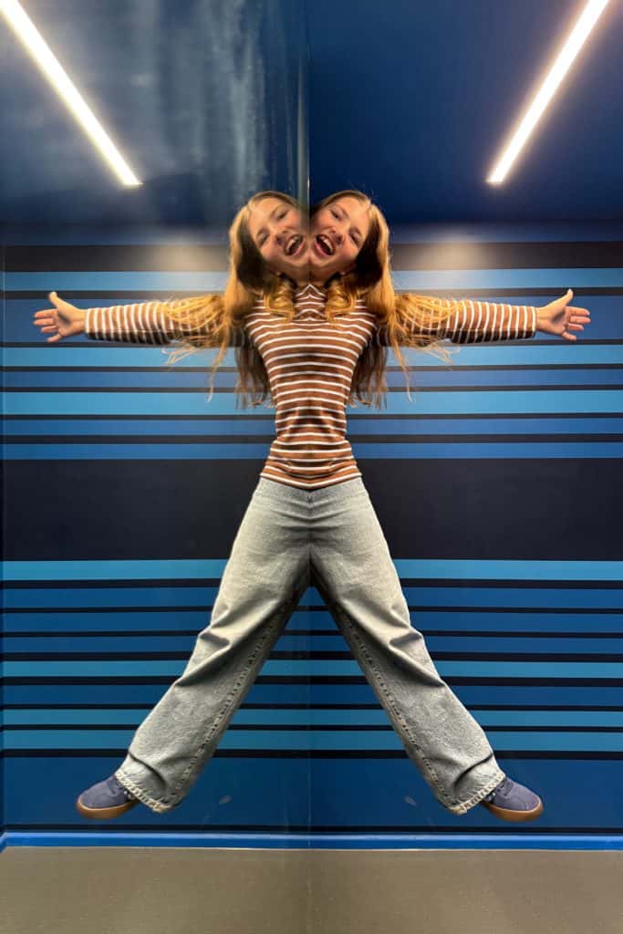 My 13-year-old in mirror illusion that shows two of her