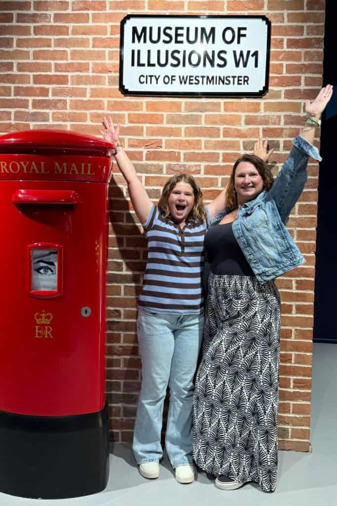 Me and my 11-year-old stood under a sign for the Museum of Illusions in London