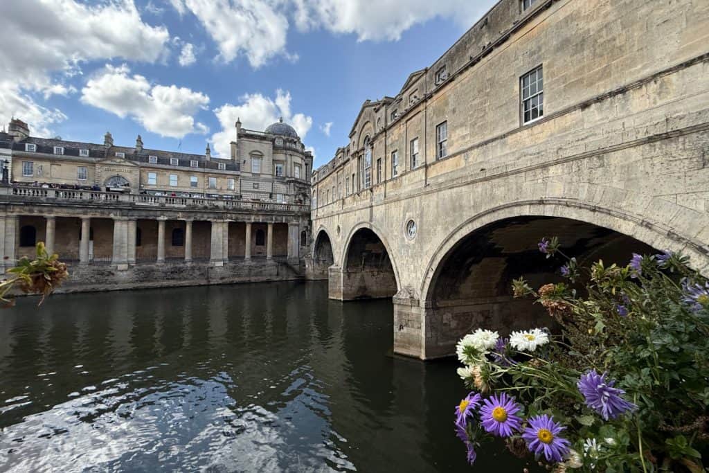 A view of the historic Pulteney Bridge in Bath from the riverside