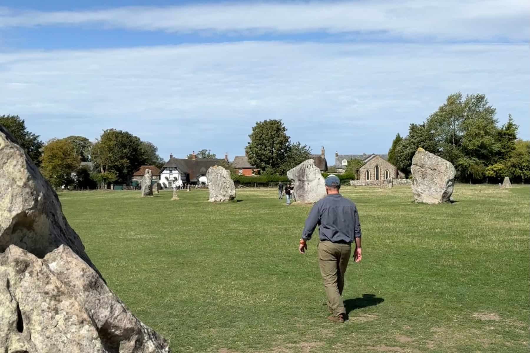 My husband walking through the Neolithic stones at Avebury in Wiltshire