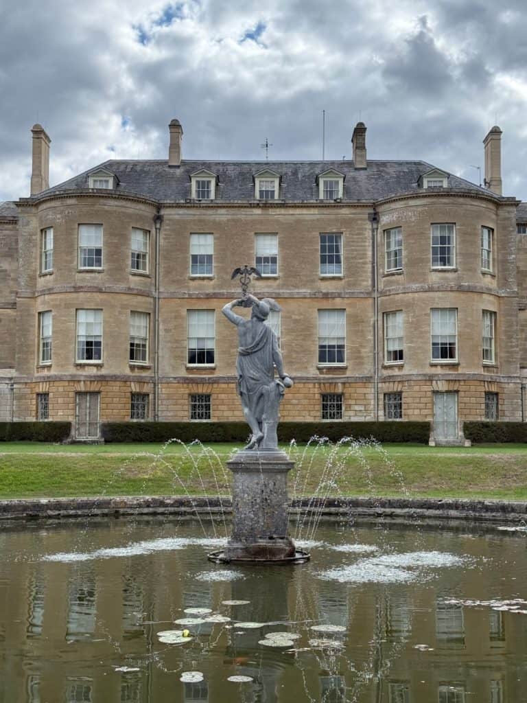 Fountain in the shape of the god mercury in the garden behind Buscot House