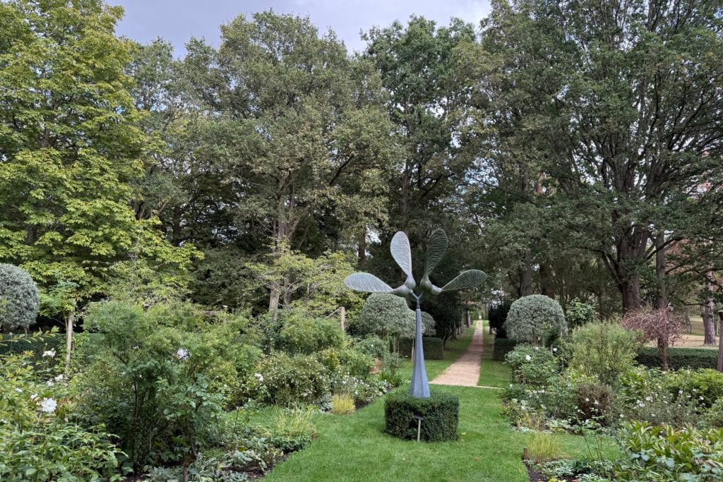 A sycamore seed inspired bronze sculpture in the Spinning Garden of Buscot Park